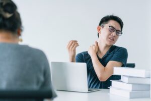 asian-working-hard-man-with-neck-strain