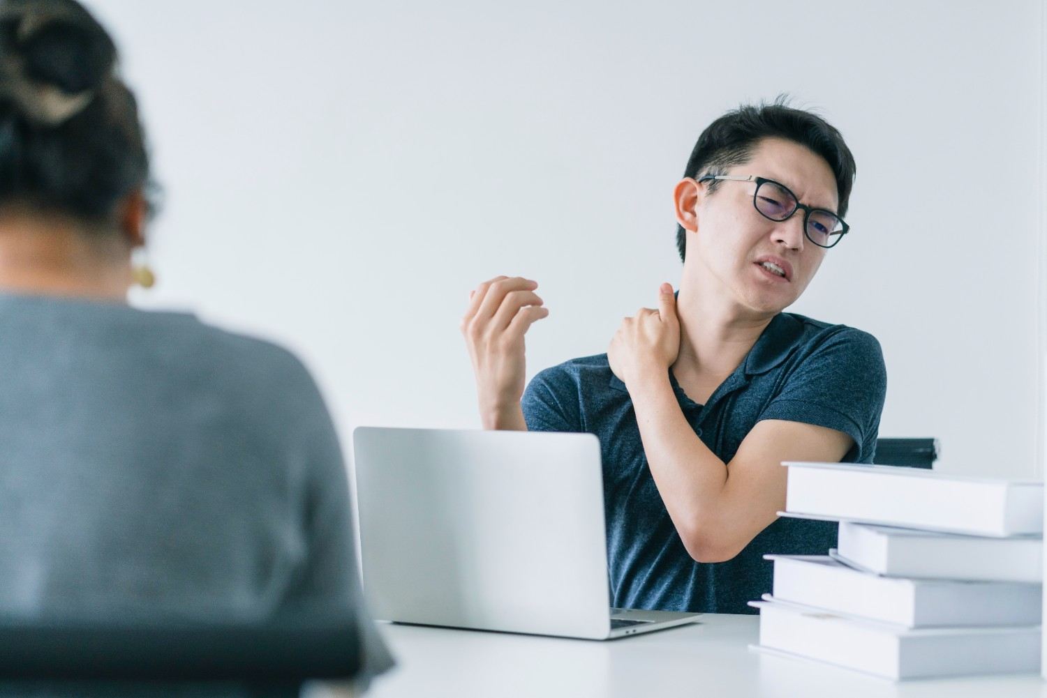 asian-working-hard-man-with-neck-strain
