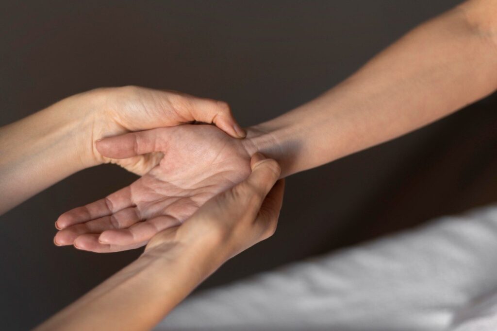 close-up-hands-massaging-wrist